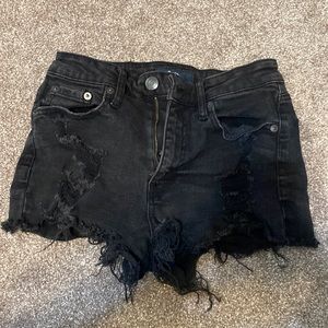 black ripped jean shorts